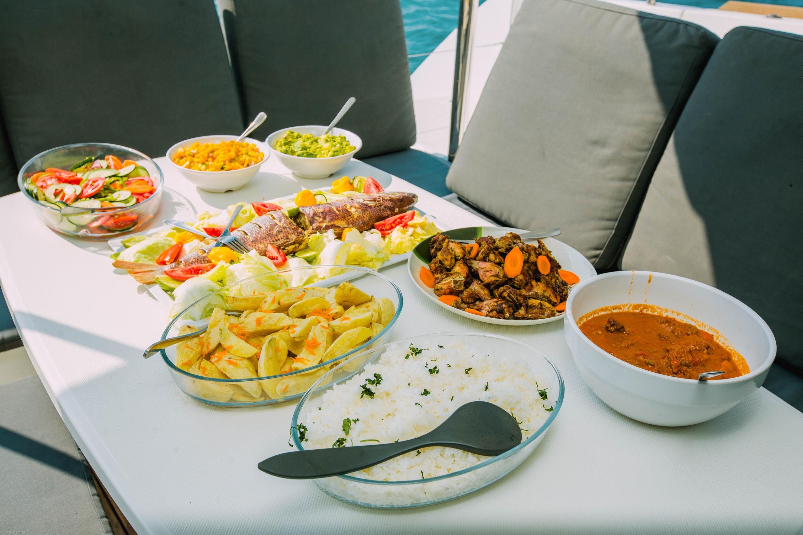 Tropical buffet spread on deck